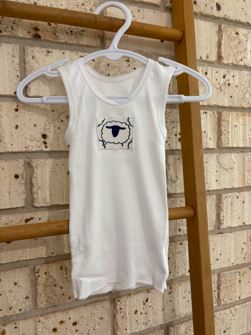 Singlet, nappy pants and bucket hat sheep