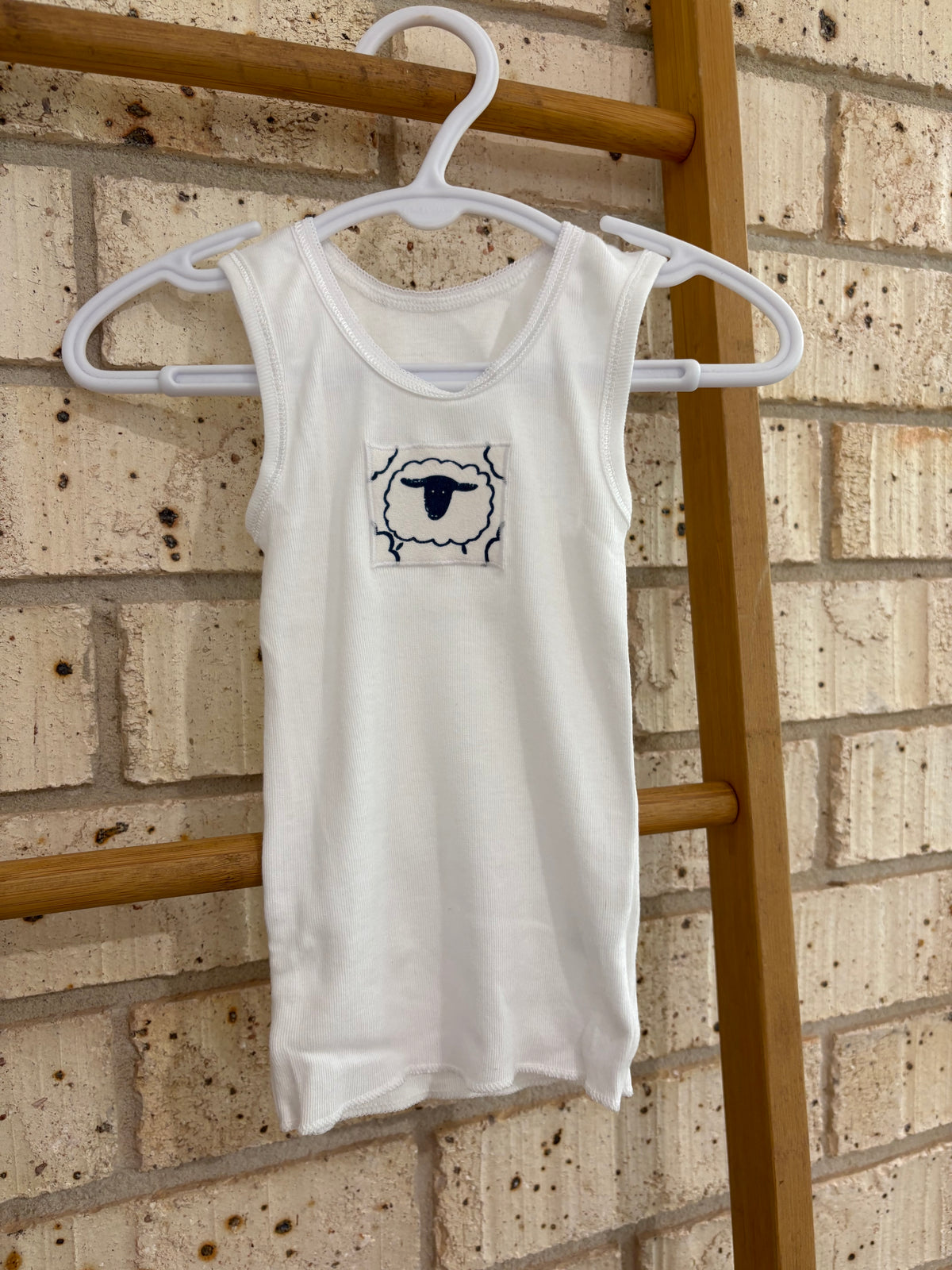 Singlet, nappy pants and bucket hat sheep